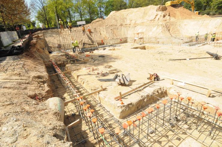 <p>The northwest corner of Ferst Drive and State Street is beginning its transformation. Workers are establishing the building footprint by preparing for the concrete foundations (i.e. the footings) and the concrete walls of the building's basement level.</p>