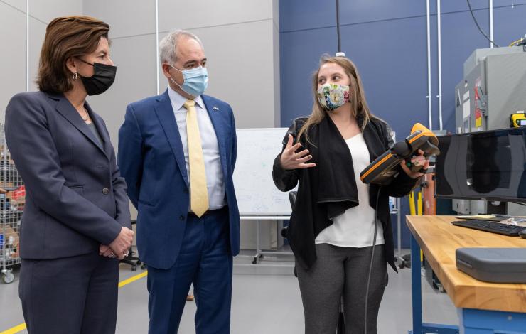 <p>Thomas Kurfess (rear left), a professor in Georgia Tech's George W. Woodruff School of Mechanical Engineering, explains some of the metallurgy testing that occurs at the Advanced Manufacturing Pilot Facility as (l-r)  U.S. Department of Commerce Secretary Gina M. Raimondo, Professor Aaron Stebner, Assistant Commerce Secretary Alejandra Castillo, and Georgia Tech President Àngel Cabrera look on. (Photo: Rob Felt)</p>