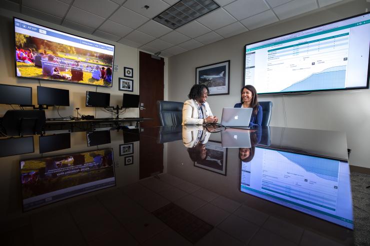 <p>GTRI Senior Research Scientist Sheila Isbell and Senior Research Associate Margarita Gonzalez are helping the Army Community Service program revamp information systems used to provide an array of social services to the families of soldiers. (Credit: Branden Camp, Georgia Tech)</p>