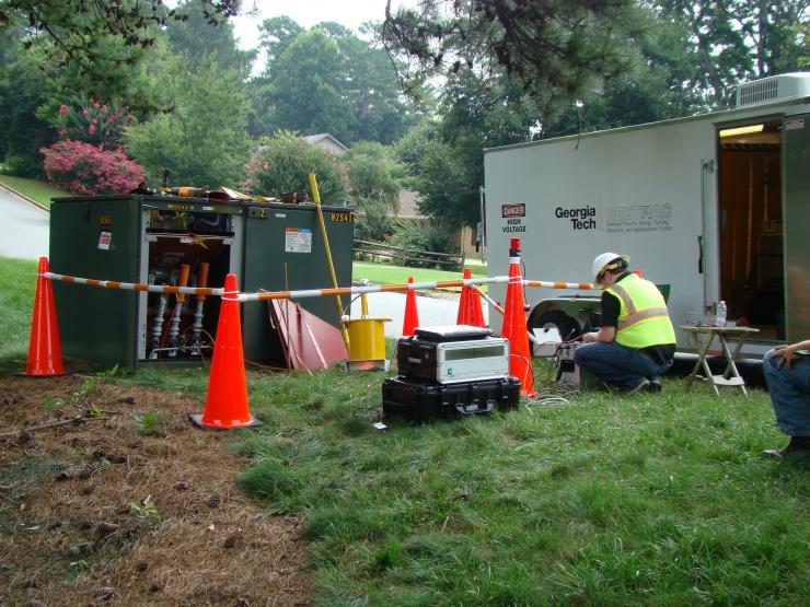 <p>NEETRAC researcher working out in the field</p>