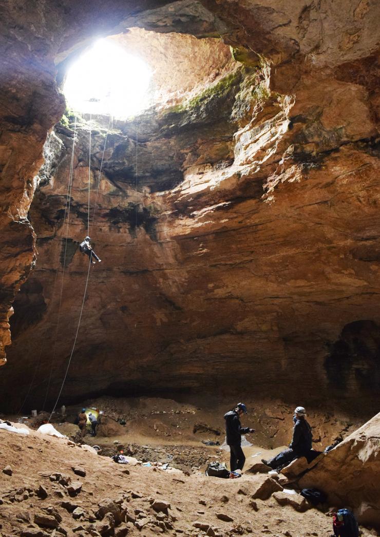 <p>Jenny McGuire rappels into Natural Trap Cave in northern Wyoming. (Photo: Jess Hunt-Ralston)</p>