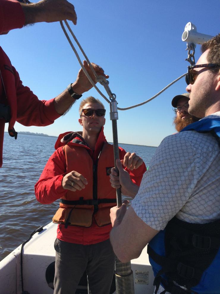 <p>Yale's Noah Planavsky (left) and Georgia Tech's Chris Reinhard (right, front) collecting estuarine sediment core samples with the goal of better understanding how animal life controls phosphorus cycling at the seabed.</p>