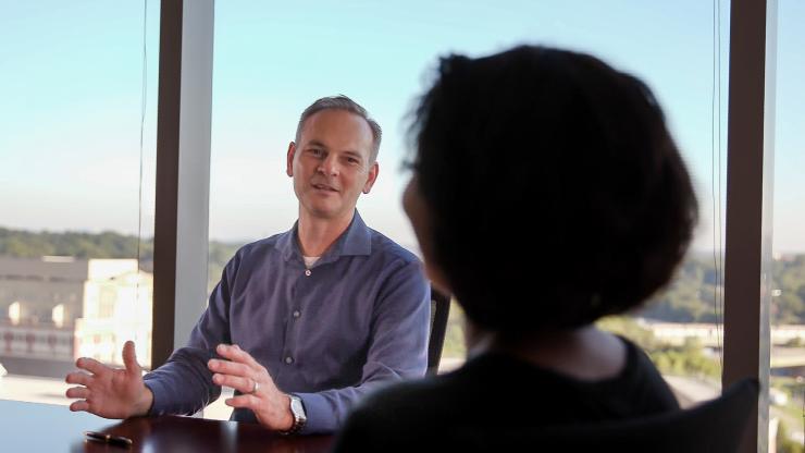 <p>Rob “Radar” Winston, the GTRI principal research engineer who directs the IMPAX program, discusses how the initiative will serve the Naval Air Warfare Center - Aircraft Division. (Credit: Branden Camp, Georgia Tech) </p>