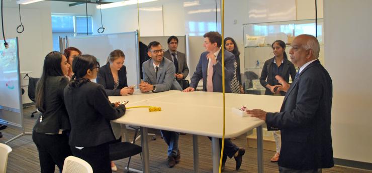 <p>MBID director Sathya Gourisankar offers some last minute advice to students shortly before their final presentations.</p>