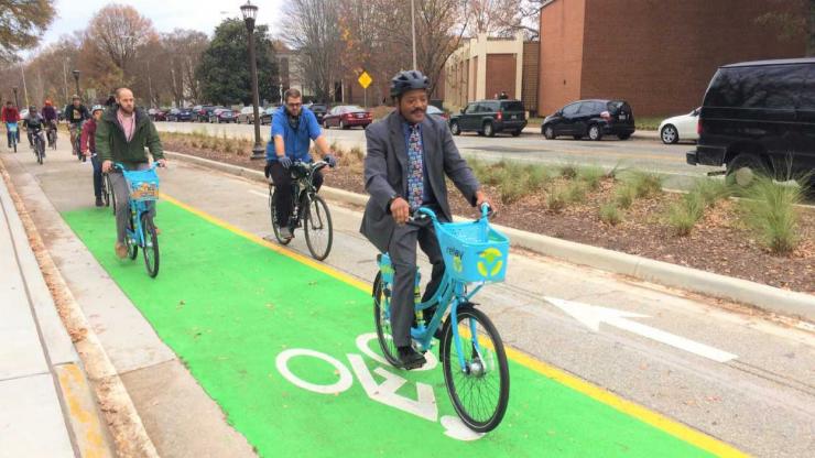 <p>Cyclists ride during the PATH Parkway ribbon-cutting event on Dec. 5.</p>