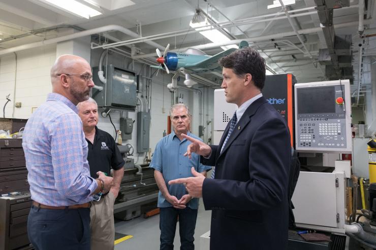 <p>Brian Gunter, assistant professor in Georgia Tech’s Guggenheim School of Aerospace Engineering, describes the school’s machine shop to Xenesis representatives. (Credit: Allison Carter, Georgia Tech)</p>

<p> </p>