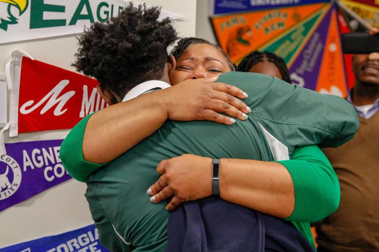 <p>Jennifer McCrary embraces her son Chris who learned of his admission to Georgia Tech in person on Friday, Jan. 11.</p>