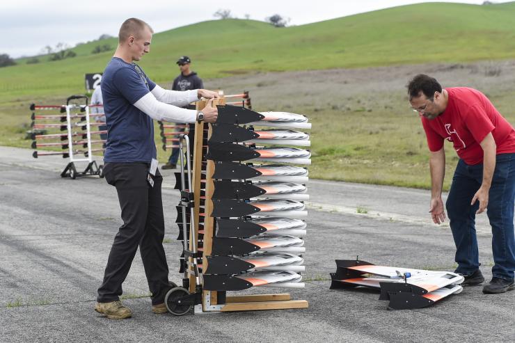 <p>Georgia Tech Research Institute researchers Evan Hammac (left) and Rick Presley prepare Zephyr aircraft for flight during a live demonstration involving teams from the Georgia Tech Research Institute and the Naval Postgraduate School. (U.S. Navy photo by Javier Chagoya)</p>