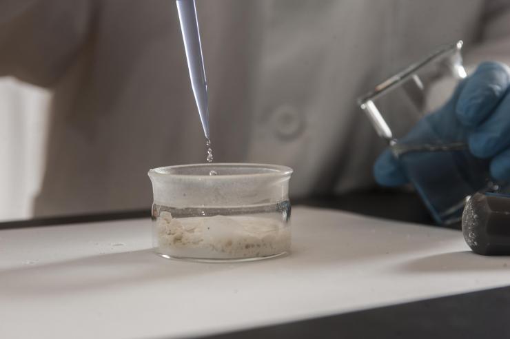 <p>The second step in measuring the chromium isotope relation: Dissolve the pulverized rock in acid. Then place the solution in a mass spectrometer, which determines how much chromium 53 and how much chromium 52 is in the sample. Credit: Georgia Tech / Christopher Moore</p>