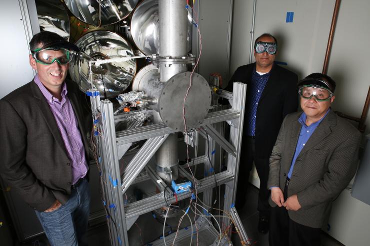 <p>Georgia Tech is part of a new U.S. Department of Energy (DOE) initiative to develop the next generation of concentrated solar power (CSP). Shown in Georgia Tech’s high-flux solar simulator facility are Peter Loutzenhiser, Devesh Ranjan and Zhuomin Zhang. (Credit: Candler Hobbs, Georgia Tech)</p>

<p> </p>