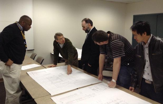 Kevin Martin (second from left) reviews plans for the Institut Lafayette cleanroom