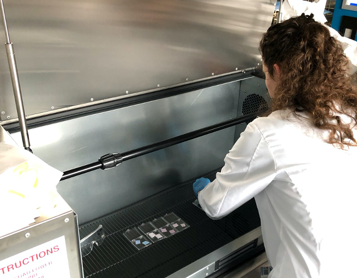 <p>Researcher Emmeline Blanchard from the Wallace H. Coulter Department of Biomedical Engineering at Georgia Tech and Emory University places items into an ozone disinfection chamber for testing. (Photo: Georgia Tech)</p>