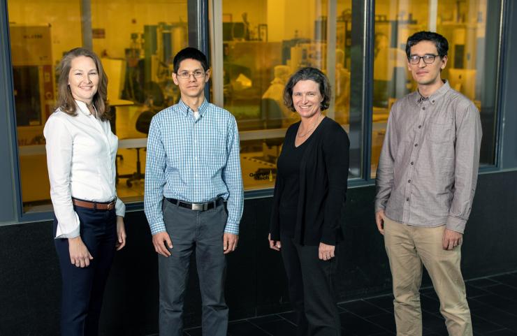 <p>GTRI researchers Brooke Beckert, Nicholas Guise, Alexa Harter and Adam Meier are shown outside the cleanroom of the Institute for Electronics and Nanotechnology at the Georgia Institute of Technology. Device fabrication for the DNA data storage project will be done in the facility behind them. (Credit: Branden Camp, Georgia Tech)</p>