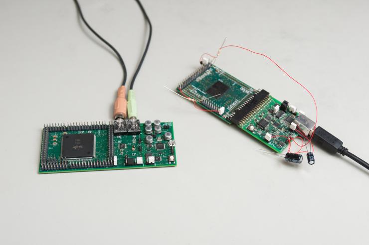 <p>Examples of FPAA chips and printed circuit boards. (Credit: Fitrah Hamid, Georgia Tech)</p>