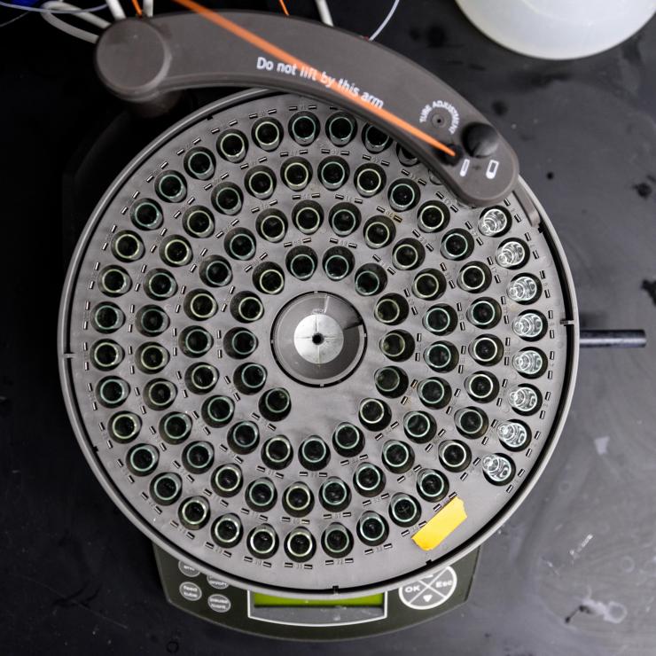 <p>A fraction collector in Raquel Lieberman's Georgia Tech lab dispenses liquid protein sample components, collecting a set volume before moving on to the next tube. Credit: Georgia Tech / Rob Felt</p>