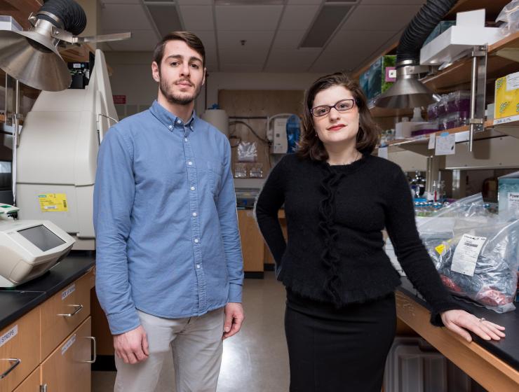 <p>Marcus Bray (left), a biology Ph.D. candidate and Jennifer Glass, assistant professor in the Georgia Institute of Technology’s School of Earth and Atmospheric Sciences, are shown in the laboratory where tiny incubators simulated early Earth conditions. (Credit: Rob Felt, Georgia Tech)</p>