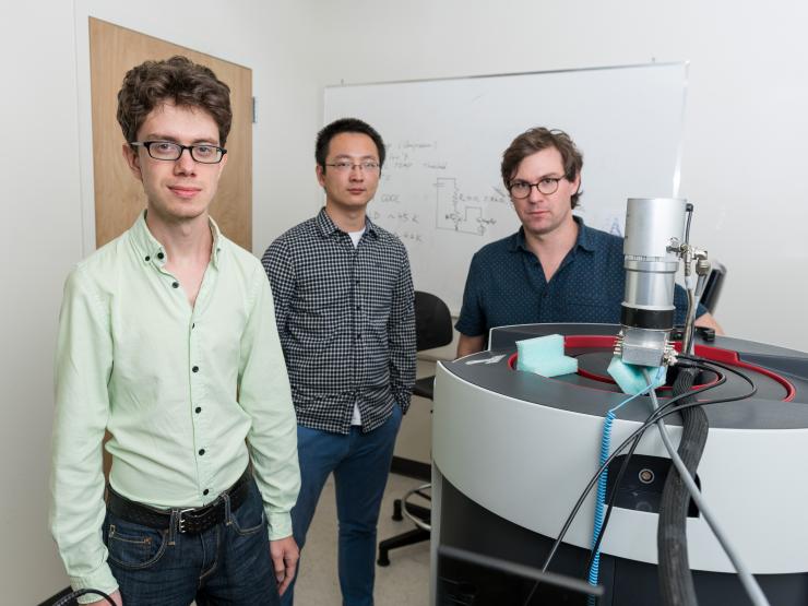 <p>Lead author Joseph Paddison (l.), Martin Mourigal (r.) in Mourigal's physics lab at Georgia Tech. Also seen, Xiaojian Bai (m.) who worked with the two on a separate study.</p>