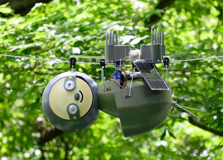 <p>SlothBot is a slow-moving and energy-efficient robot that can linger in the trees to monitor animals, plants, and the environment below. It has been installed for testing in the Atlanta Botanical Garden. (Credit: Rob Felt, Georgia Tech)</p>