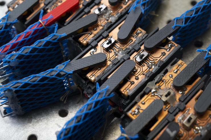 A group of smart active particles (smarticles), simple robots used to study interactions similar to those of the “worm blobs” formed by California blackworms. (Credit: Christopher Moore, Georgia Tech)