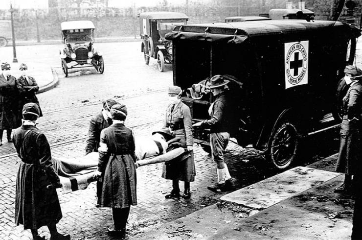 <p>An ambulance in St. Louis, Missouri, picks up a patient believed to be infected with influenza in the 1918-19 Spanish flu pandemic, which killed 50 million people or more worldwide. Credit: National Archives</p>