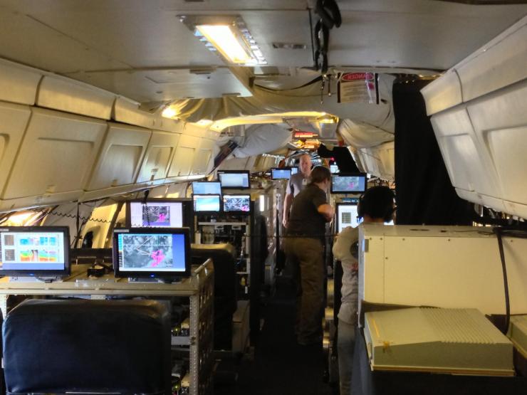 <p>NASA DC-8, packed with atmospheric measurement instruments and researchers, ready to take data near a wildfire. Credit: NASA / Kent Shiffer</p>