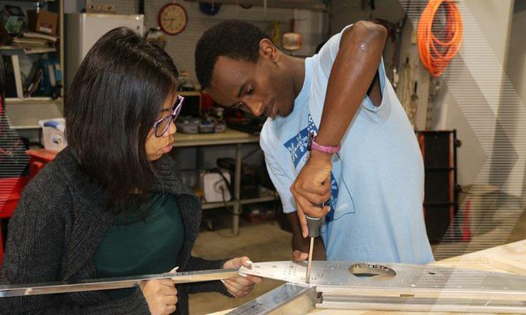 <p>Biya Haile working in the lab</p>