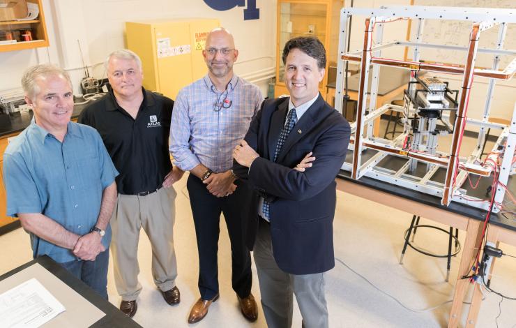 <p>Group photo of Xenesis officials visiting Georgia Tech. Shown are Neal Campion, Xenesis Strategy Director; Mike Carey, Chief Strategy Officer at Atlas Space Operations; Mark LaPenna, Xenesis CEO and Founder, and Brian Gunter, an assistant professor in Georgia Tech’s Guggenheim School of Aerospace Engineering. (Credit: Allison Carter, Georgia Tech)</p>

<p> </p>