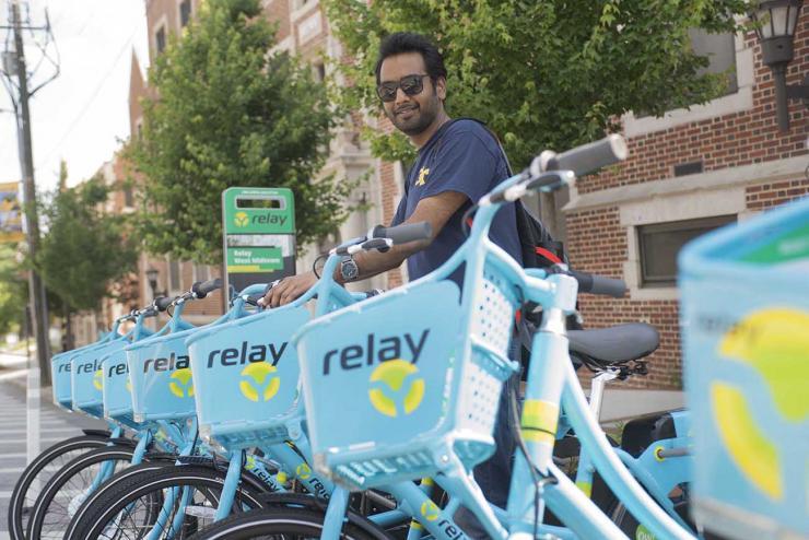 <p>Anirudh Gattani, a civil engineering graduate student, approaches the Relay bike hub on Techwood Drive at North Avenue. </p>