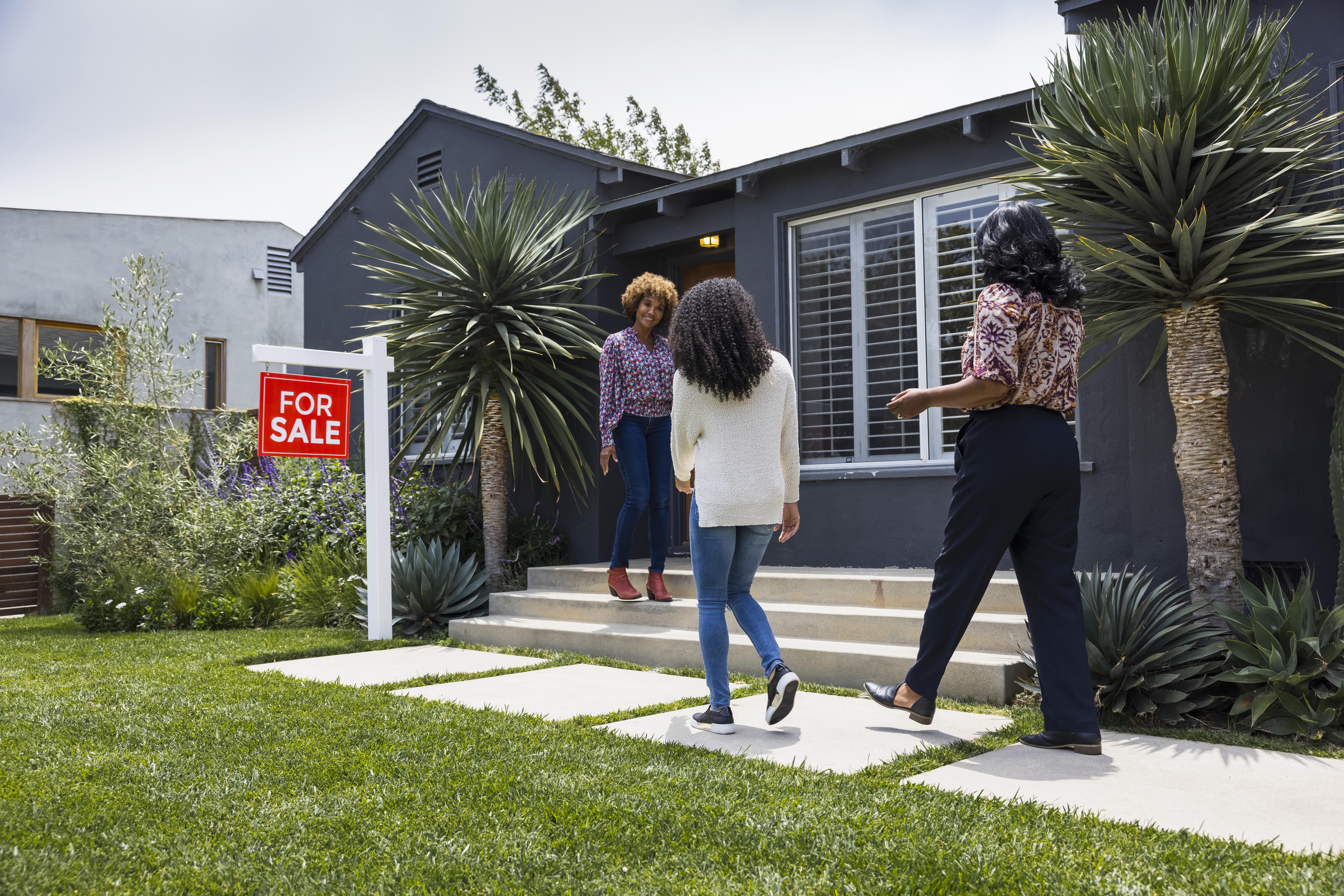 Buyers walking into house