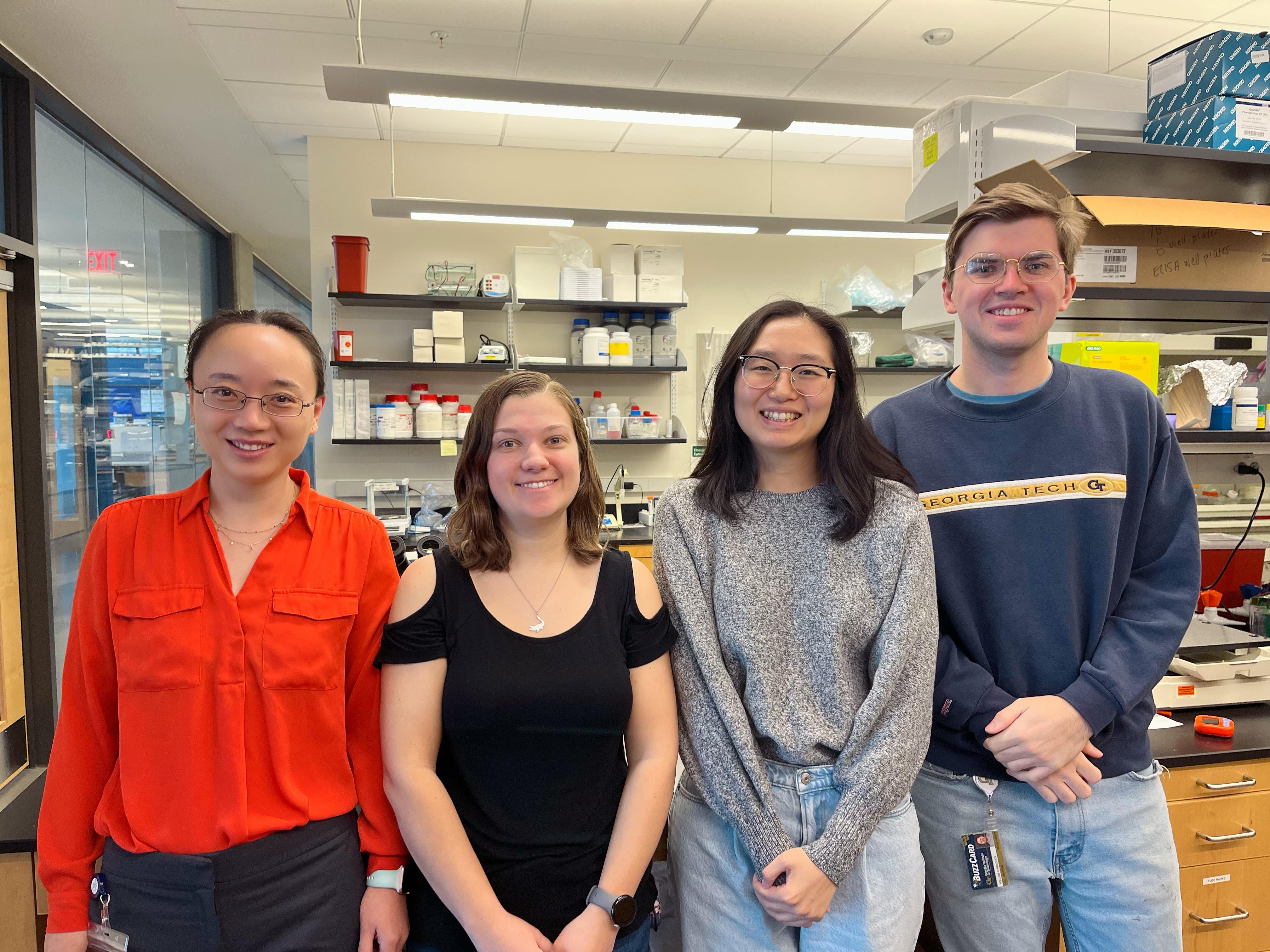 School of Biological Sciences Associate Professor Liang Han (left) with members of her lab, including Laboratory Technicians Katy Lawson (center left) and William Hancock (right), as well as biology Ph.D. student Rossie Nho.