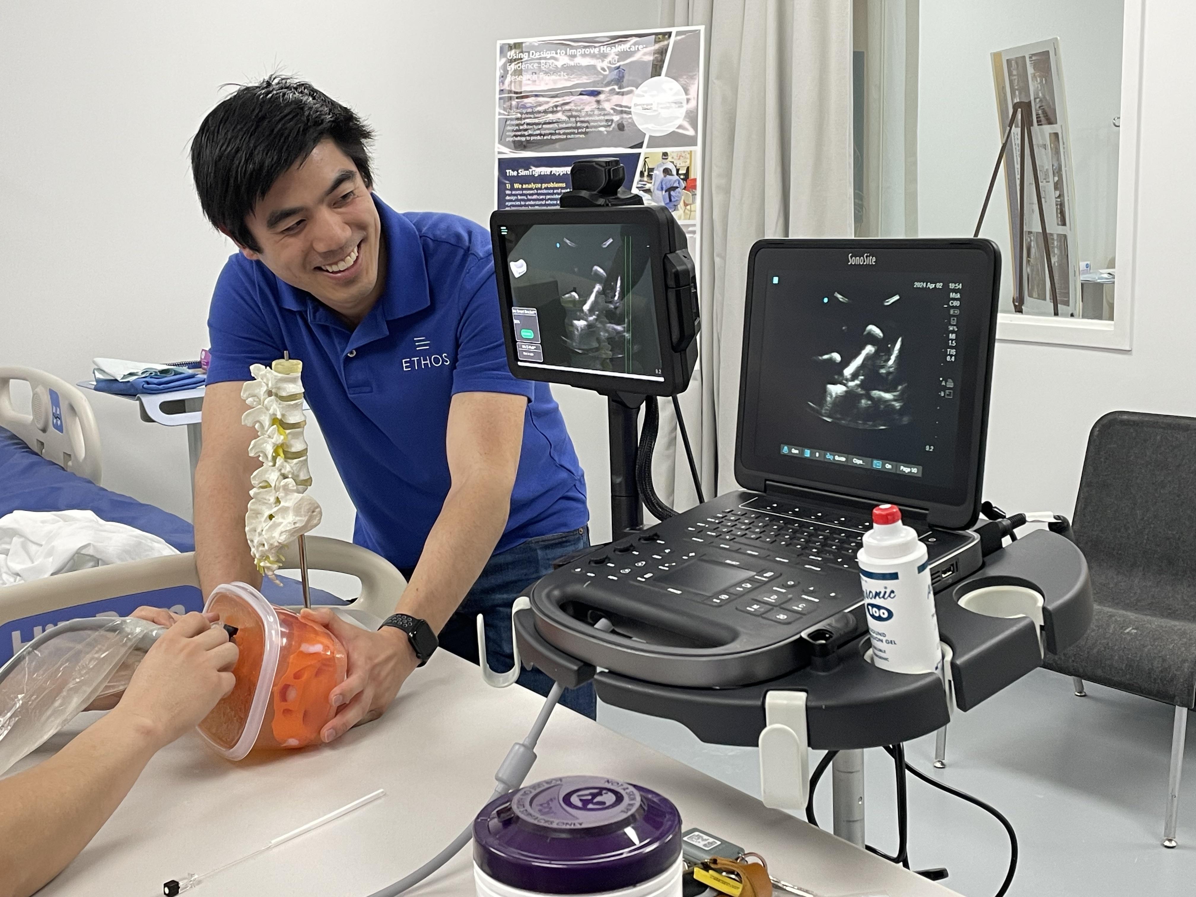 Cassidy Wang interacting with a physician who is testing Ethos' needle guidance system.