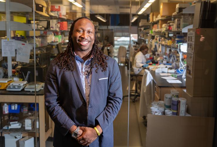 <p>Manu Platt stands outside his lab at Georgia Tech. Platt, an associate professor, researches cathepsins in the context of multiple diseases, including cancer, atherosclerosis, and sickle cell disease. Credit: Georgia Tech / Allison Carter</p>