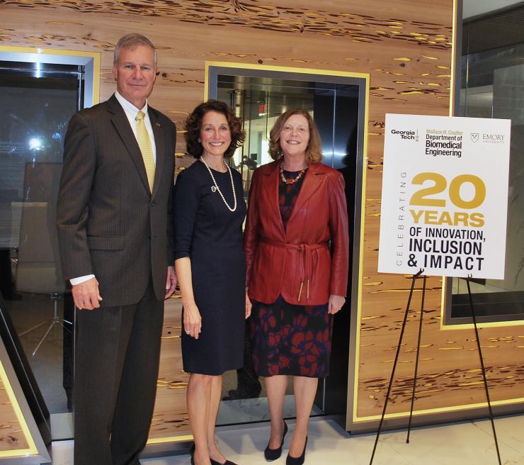 <p>Coulter Department Chair Susan Margulies (center) is flanked by Georgia Tech President Bud Peterson and Emory University President Claire Sterk.</p>