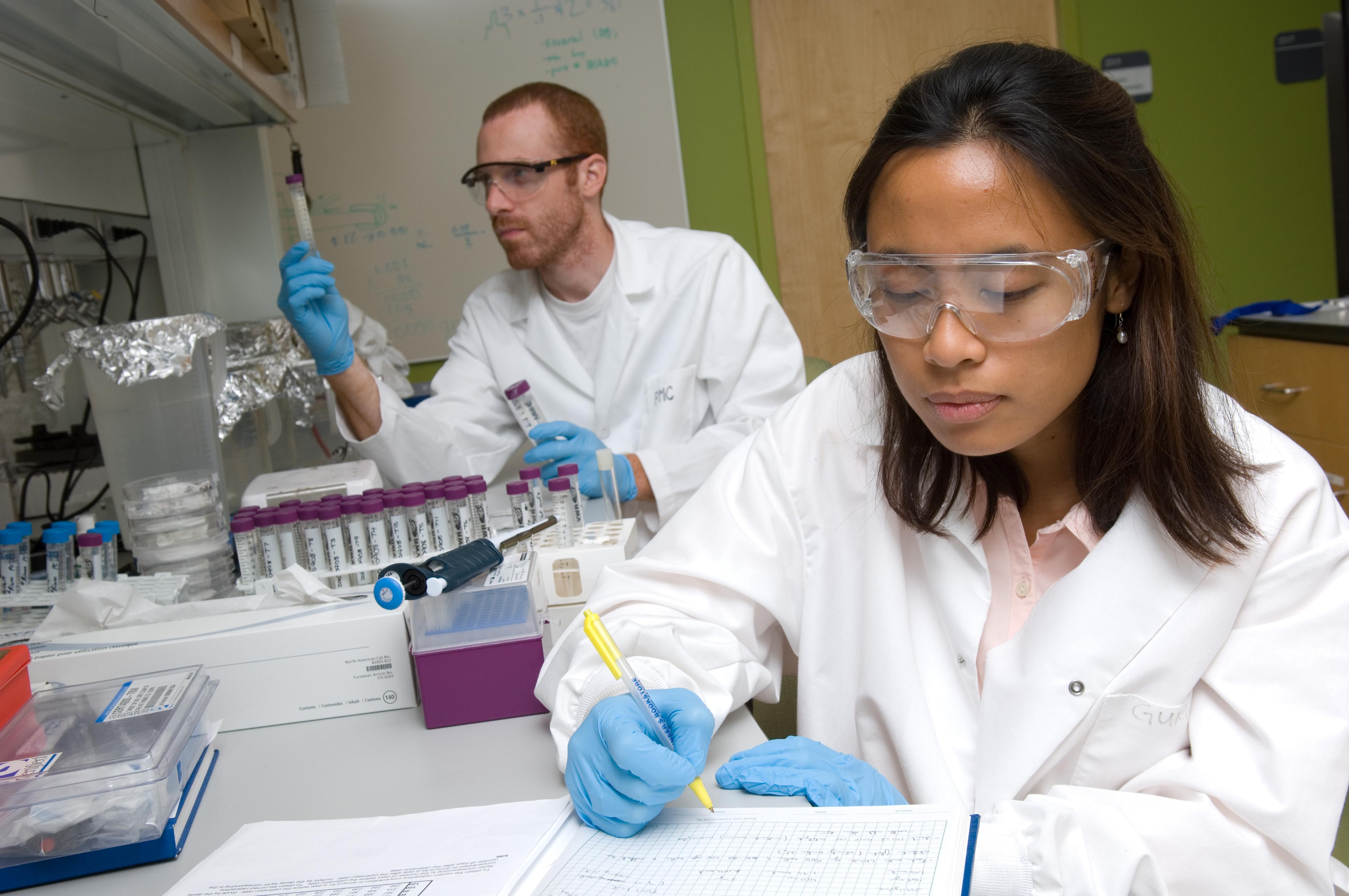 Two Georgia Tech researchers working in a lab.