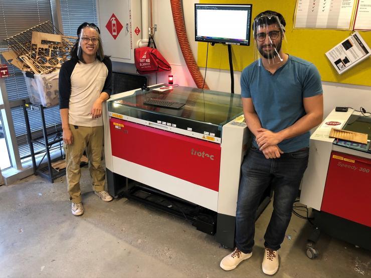 <p>To help meet the need for personal protective equipment (PPE) for health care workers, Georgia Tech has designed and is producing face shields. Shown is a laser cutting machine used to create frames for the shields.</p>