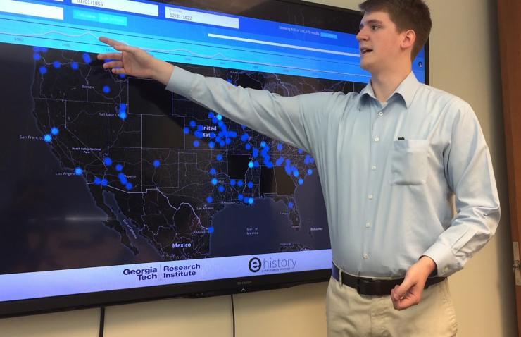 <p>Georgia Tech Research Institute (GTRI) Research Scientist Trevor Goodyear shows features of U.S. News Map, a database of more than 10 million newspaper pages that is helping researchers see history with spatial information that hadn’t been available before. (Credit: Georgia Tech).</p>