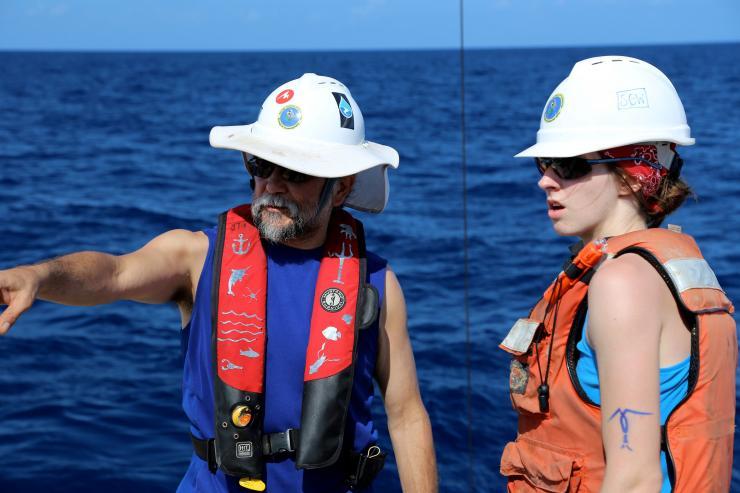 <p>Georgia Tech Professor Joe Montoya and graduate student Sarah Weber prepare to recover equipment used to gather water samples in the Gulf of Mexico. (Credit: Ryan Sibert, University of Georgia)</p>