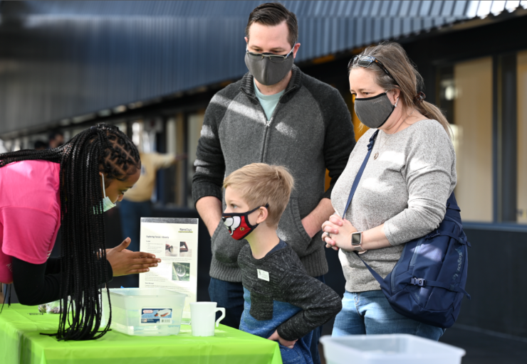 Family learning at demo booth