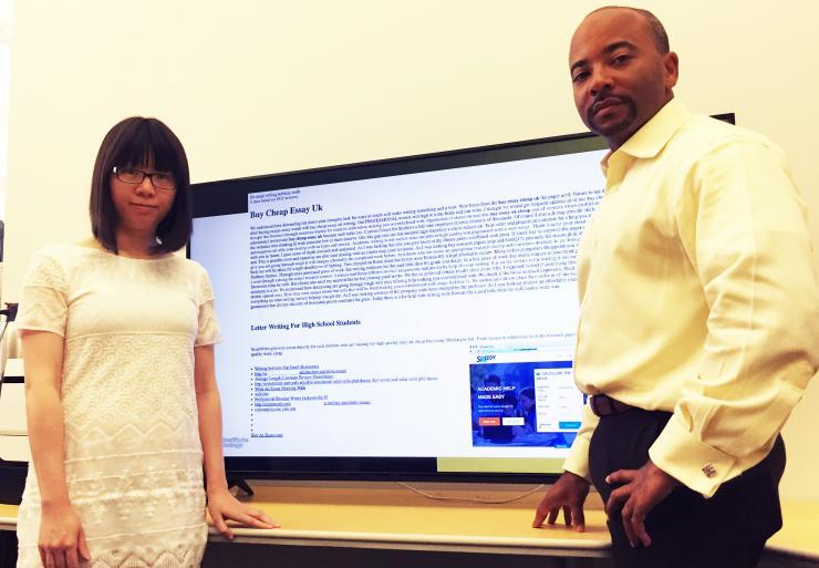 <p>Georgia Tech Ph.D. student Xiaojing Liao and Professor Raheem Beyah are shown with a typical promotional infection, this one advertising essays for sale. (Credit: John Toon, Georgia Tech).</p>